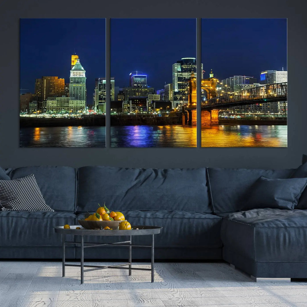 The "Cincinnati City Lights Night Skyline Cityscape" canvas print, displayed above a sofa, exhibits museum-quality craftsmanship with a UV-protective coating.