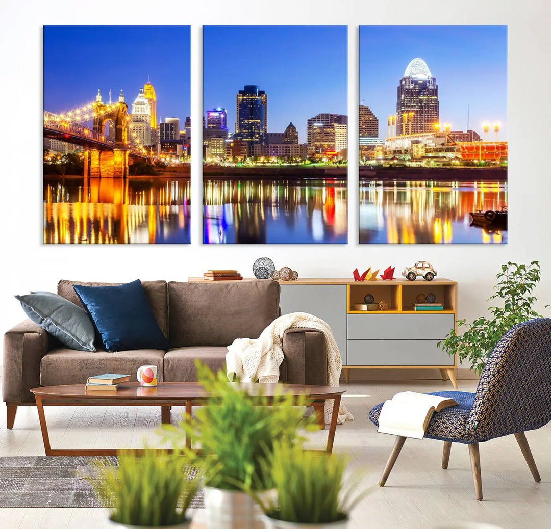 The "Cincinnati City Lights Night Skyline Cityscape View Wall Art Canvas Print" is a gallery-wrapped, museum-quality canvas illustrating a lit-up bridge and skyline at night. Enhanced with a UV-protective coating, this piece ensures lasting vibrancy.