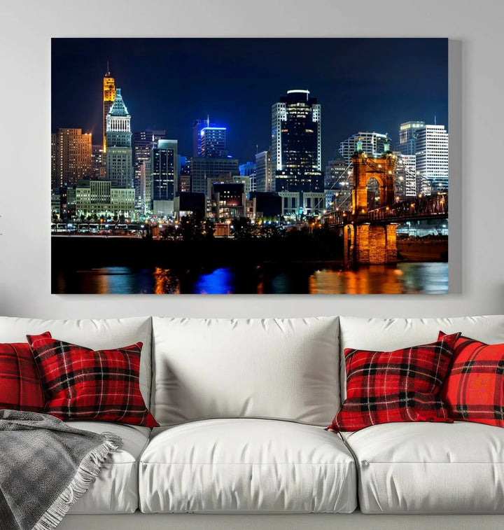 The "Cincinnati City Lights Night Skyline Cityscape View" wall art is displayed on museum-quality canvas with a UV-protective coating for lasting durability.