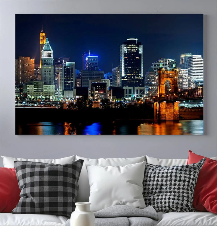 The "Cincinnati City Lights Night Skyline Cityscape View" wall art is displayed on museum-quality canvas with a UV-protective coating for lasting durability.