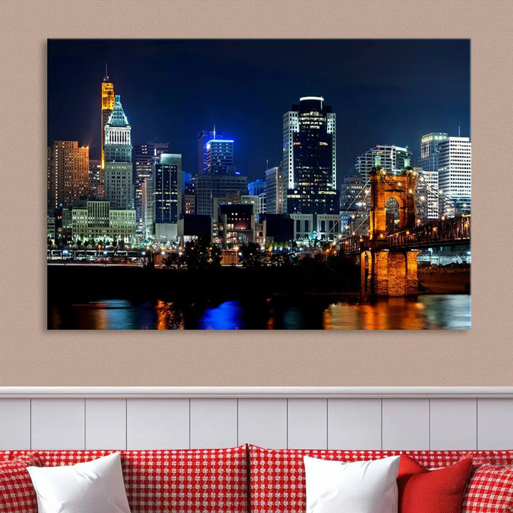 The "Cincinnati City Lights Night Skyline Cityscape View" wall art is displayed on museum-quality canvas with a UV-protective coating for lasting durability.