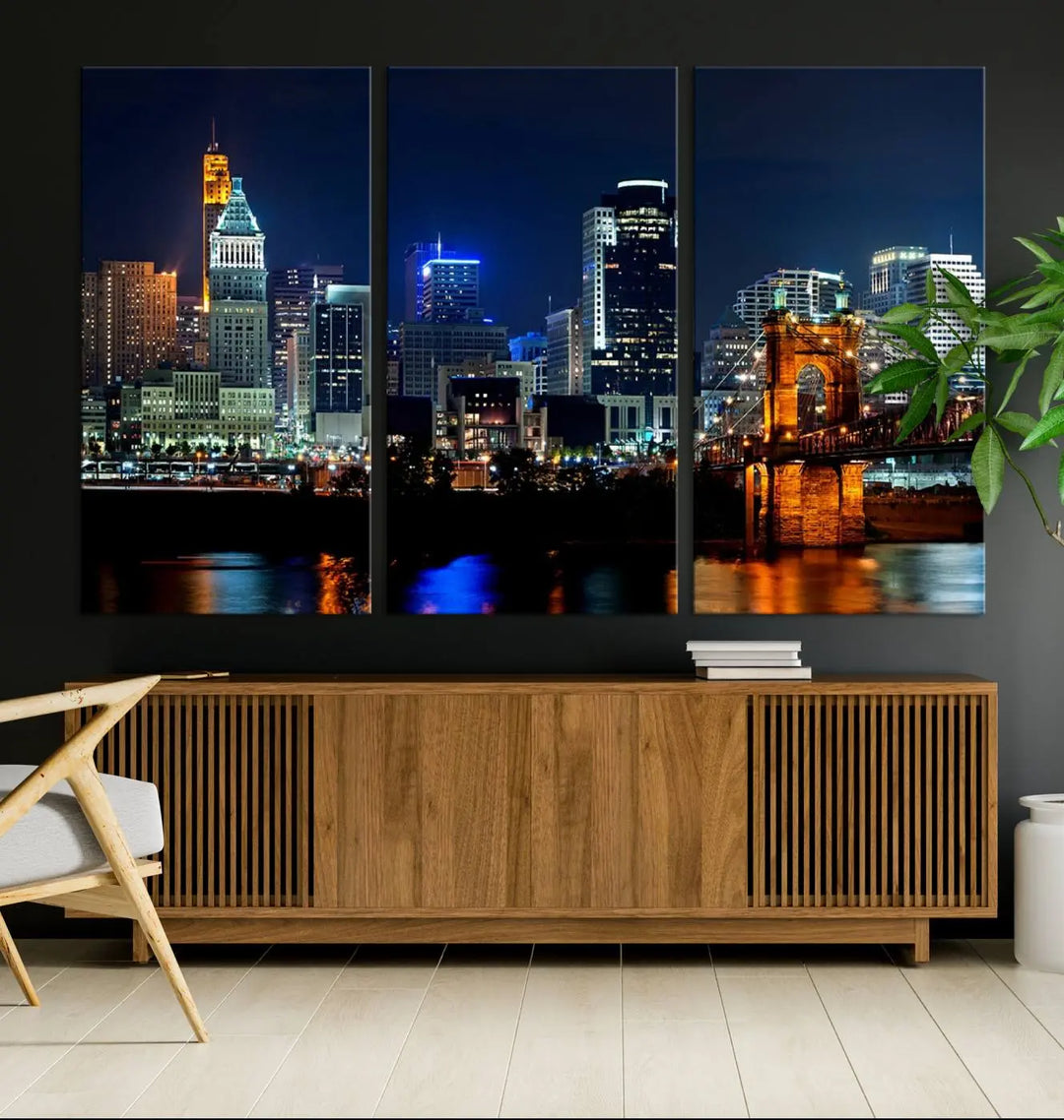 The "Cincinnati City Lights Night Skyline Cityscape View" wall art is displayed on museum-quality canvas with a UV-protective coating for lasting durability.