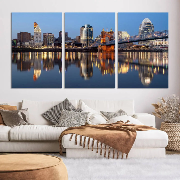 The Cincinnati City Lights Night Skyline Cityscape View Wall Art Canvas Print elegantly hangs, its vibrant reflections dancing on the water. The gallery-wrapped image is crafted on museum-quality canvas, ensuring a stunning display.