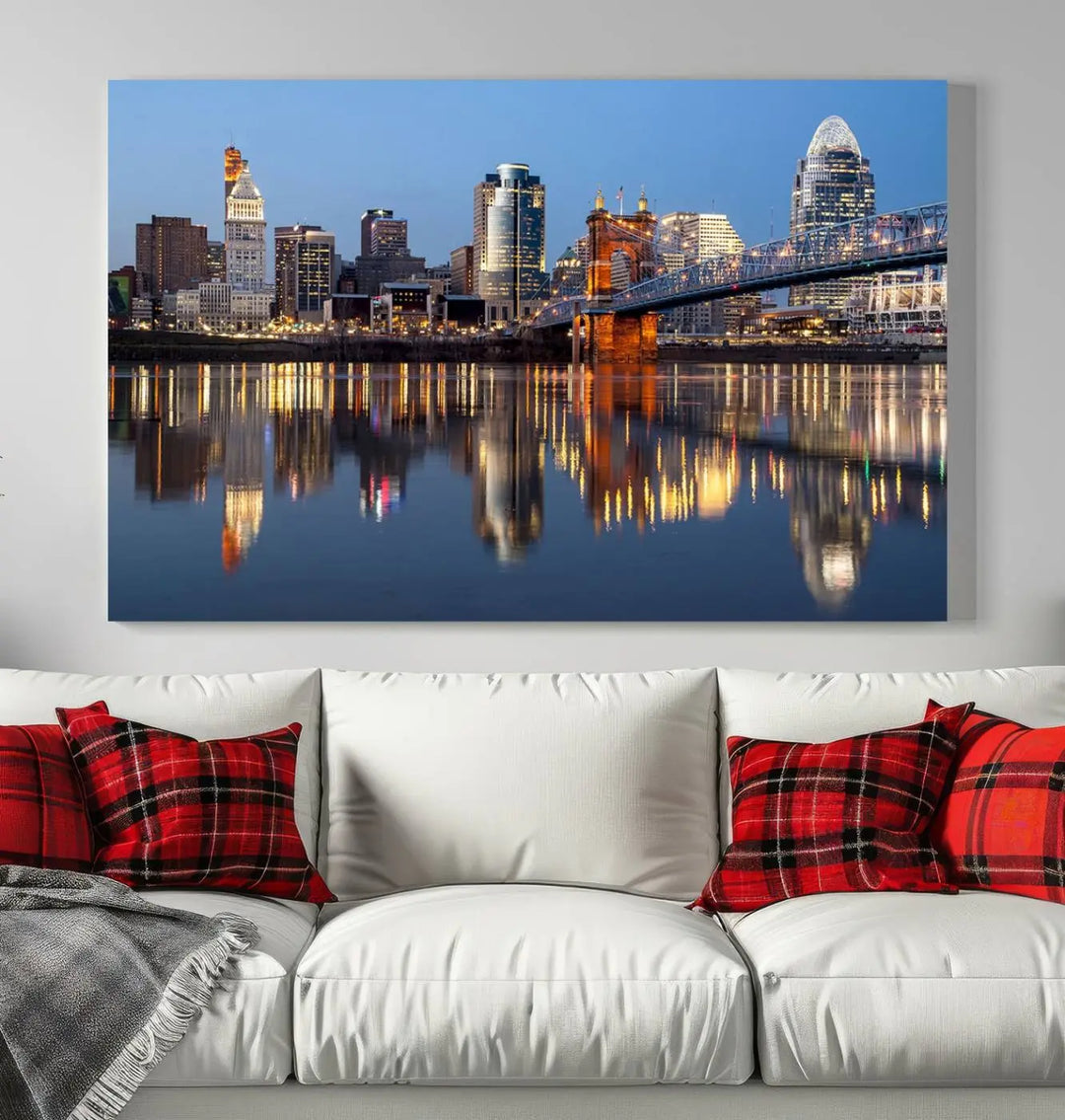 The Cincinnati City Lights Night Skyline Cityscape View Wall Art Canvas Print elegantly hangs, its vibrant reflections dancing on the water. The gallery-wrapped image is crafted on museum-quality canvas, ensuring a stunning display.