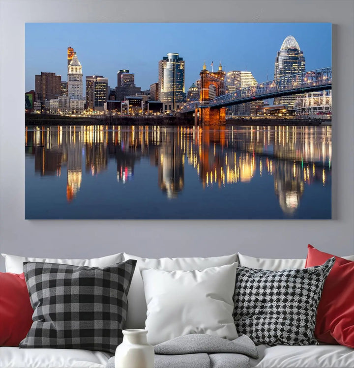 The Cincinnati City Lights Night Skyline Cityscape View Wall Art Canvas Print elegantly hangs, its vibrant reflections dancing on the water. The gallery-wrapped image is crafted on museum-quality canvas, ensuring a stunning display.