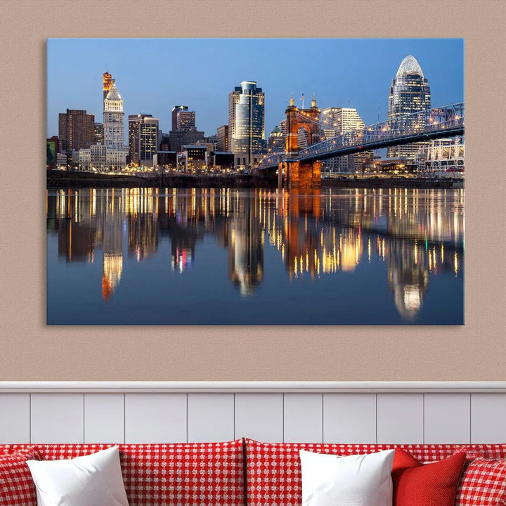 The Cincinnati City Lights Night Skyline Cityscape View Wall Art Canvas Print elegantly hangs, its vibrant reflections dancing on the water. The gallery-wrapped image is crafted on museum-quality canvas, ensuring a stunning display.