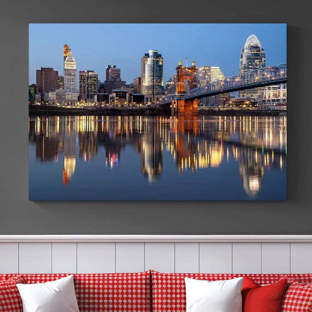 The Cincinnati City Lights Night Skyline Cityscape View Wall Art Canvas Print elegantly hangs, its vibrant reflections dancing on the water. The gallery-wrapped image is crafted on museum-quality canvas, ensuring a stunning display.