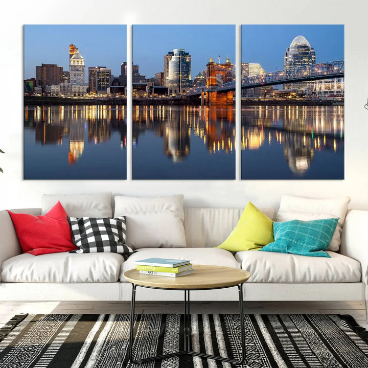 The Cincinnati City Lights Night Skyline Cityscape View Wall Art Canvas Print elegantly hangs, its vibrant reflections dancing on the water. The gallery-wrapped image is crafted on museum-quality canvas, ensuring a stunning display.