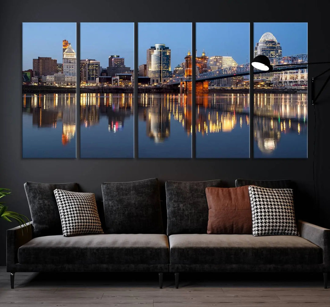 The Cincinnati City Lights Night Skyline Cityscape View Wall Art Canvas Print elegantly hangs, its vibrant reflections dancing on the water. The gallery-wrapped image is crafted on museum-quality canvas, ensuring a stunning display.