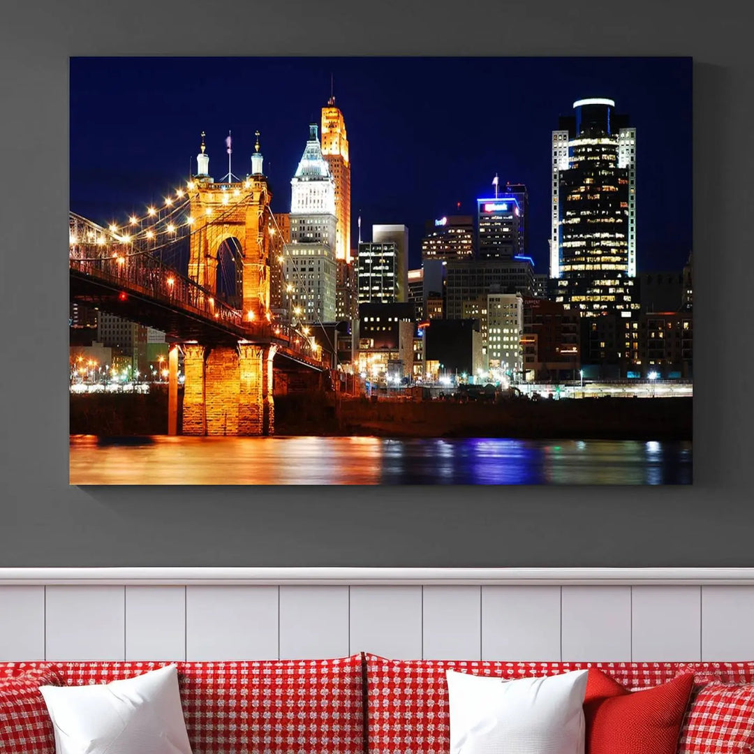 The Cincinnati City Lights Night Skyline Cityscape View Wall Art Canvas Print showcases a stunning night view of a city skyline with an illuminated bridge, making it an ideal museum-quality addition.