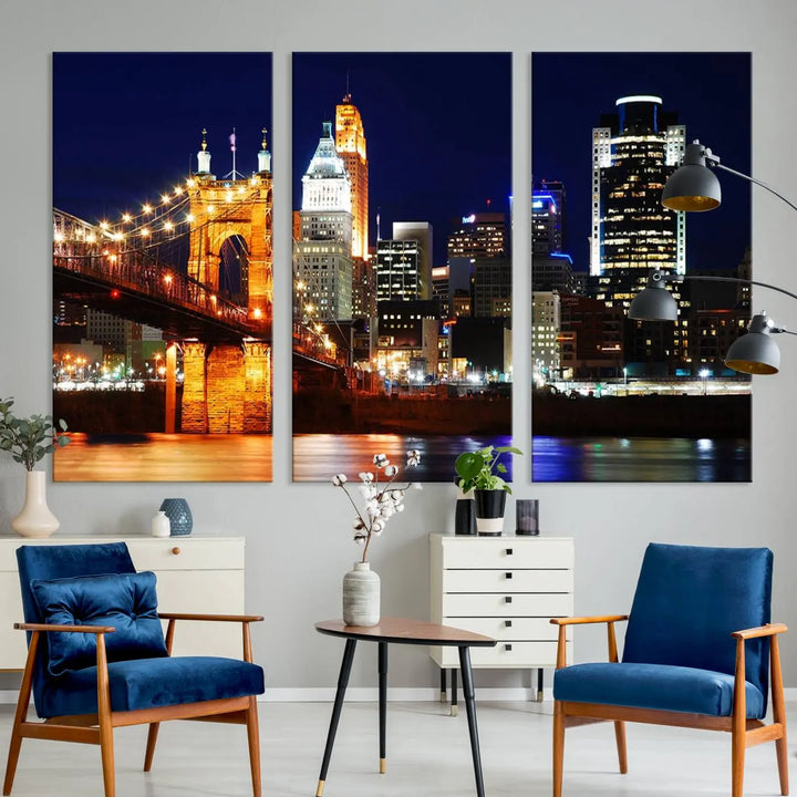 The Cincinnati City Lights Night Skyline Cityscape View Wall Art Canvas Print showcases a stunning night view of a city skyline with an illuminated bridge, making it an ideal museum-quality addition.