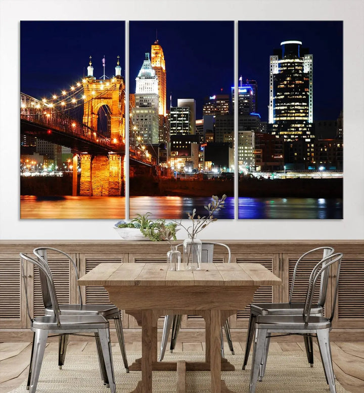 The Cincinnati City Lights Night Skyline Cityscape View Wall Art Canvas Print showcases a stunning night view of a city skyline with an illuminated bridge, making it an ideal museum-quality addition.