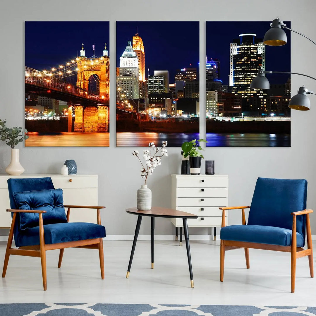 The Cincinnati City Lights Night Skyline Cityscape View Wall Art Canvas Print showcases a stunning night view of a city skyline with an illuminated bridge, making it an ideal museum-quality addition.