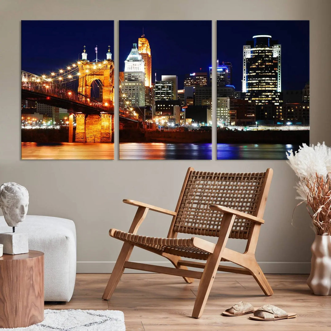 The Cincinnati City Lights Night Skyline Cityscape View Wall Art Canvas Print showcases a stunning night view of a city skyline with an illuminated bridge, making it an ideal museum-quality addition.