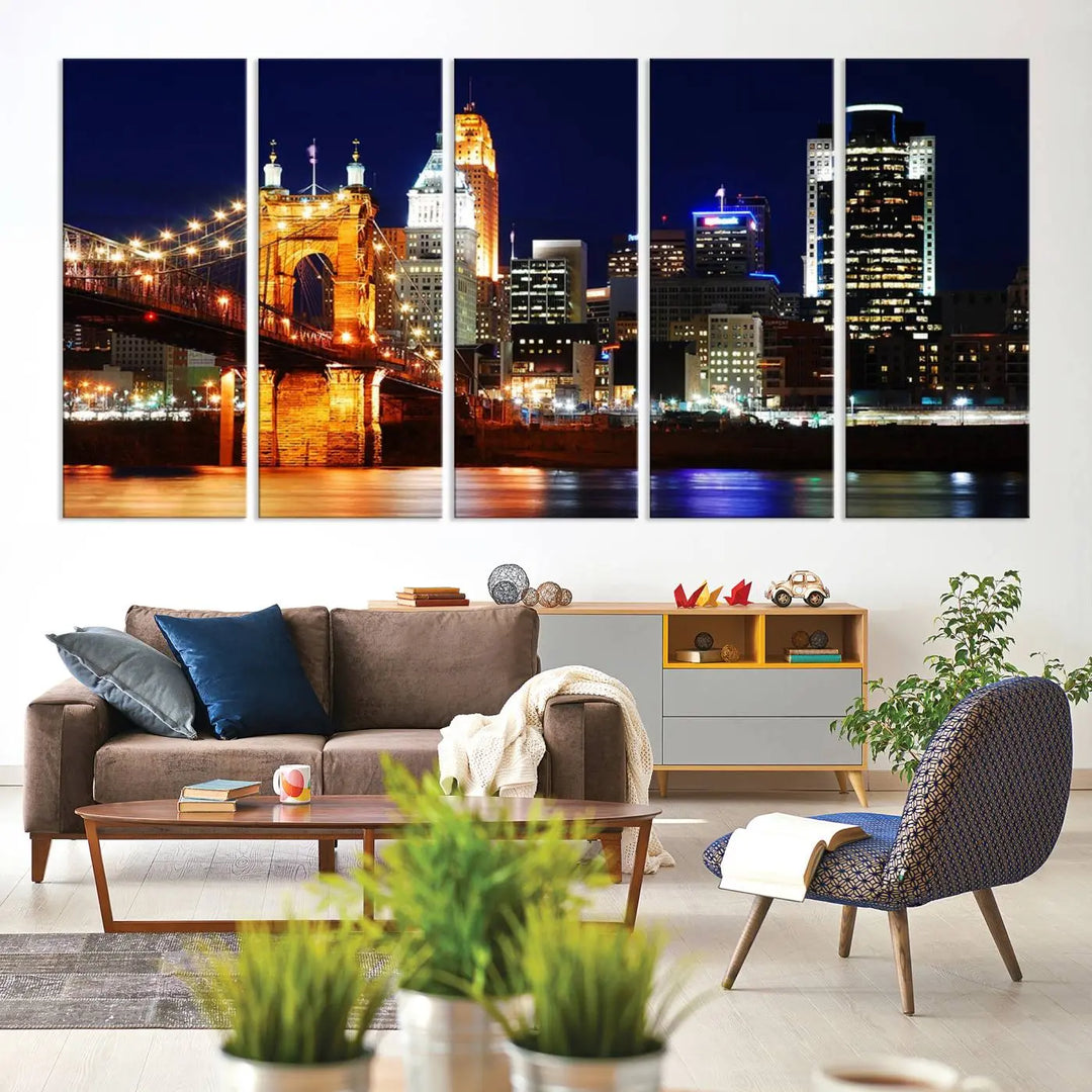 The Cincinnati City Lights Night Skyline Cityscape View Wall Art Canvas Print showcases a stunning night view of a city skyline with an illuminated bridge, making it an ideal museum-quality addition.