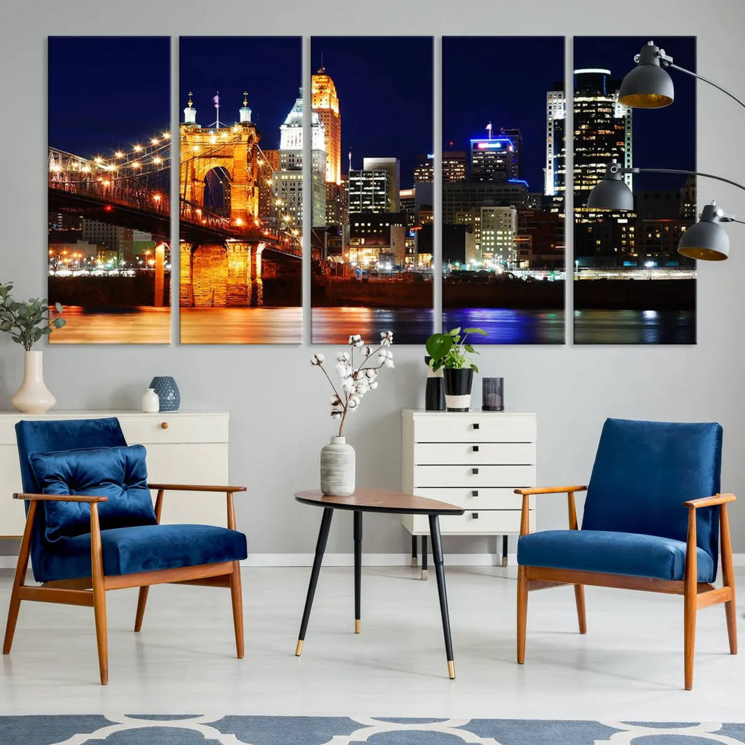 The Cincinnati City Lights Night Skyline Cityscape View Wall Art Canvas Print showcases a stunning night view of a city skyline with an illuminated bridge, making it an ideal museum-quality addition.