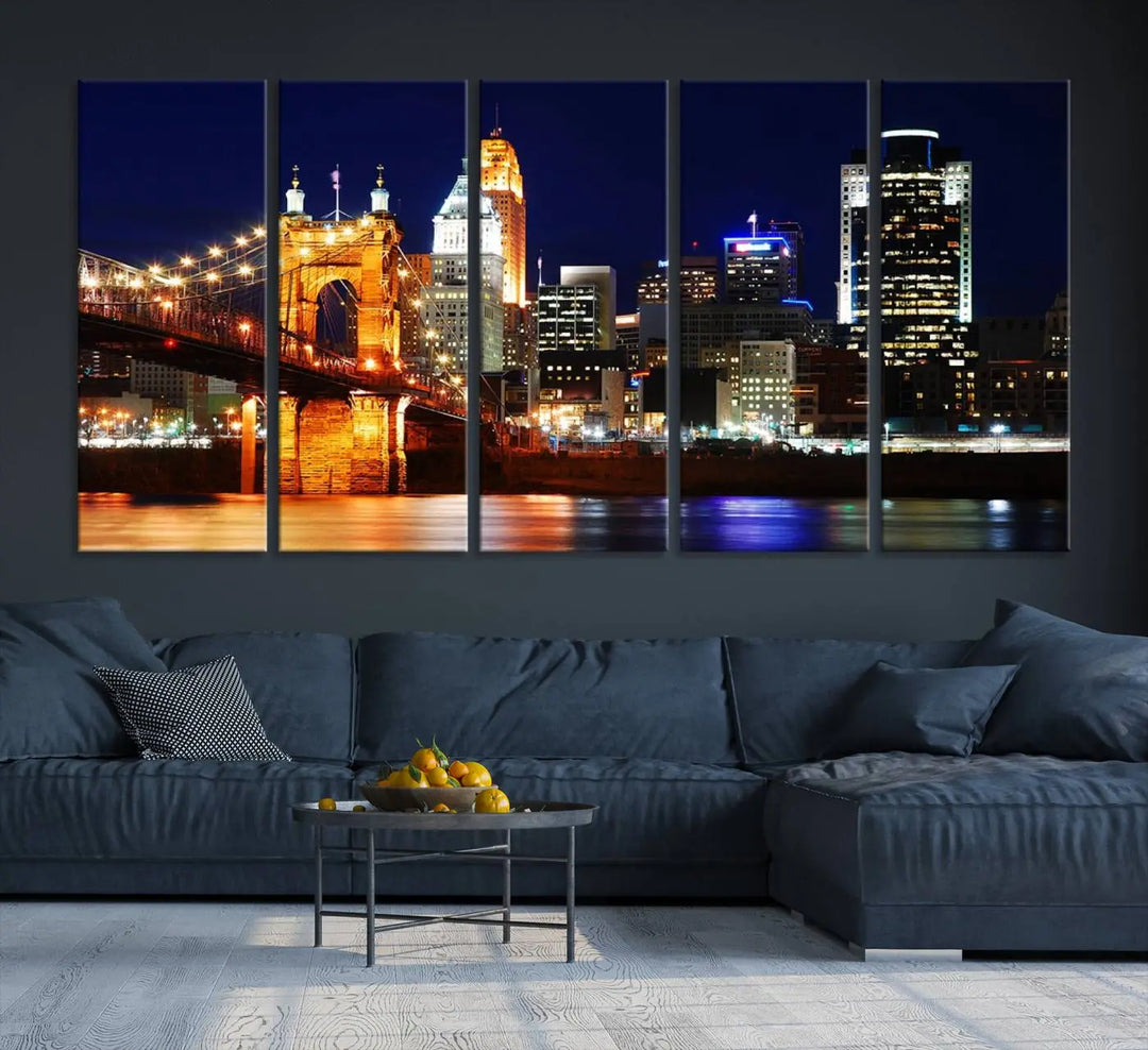 The Cincinnati City Lights Night Skyline Cityscape View Wall Art Canvas Print showcases a stunning night view of a city skyline with an illuminated bridge, making it an ideal museum-quality addition.