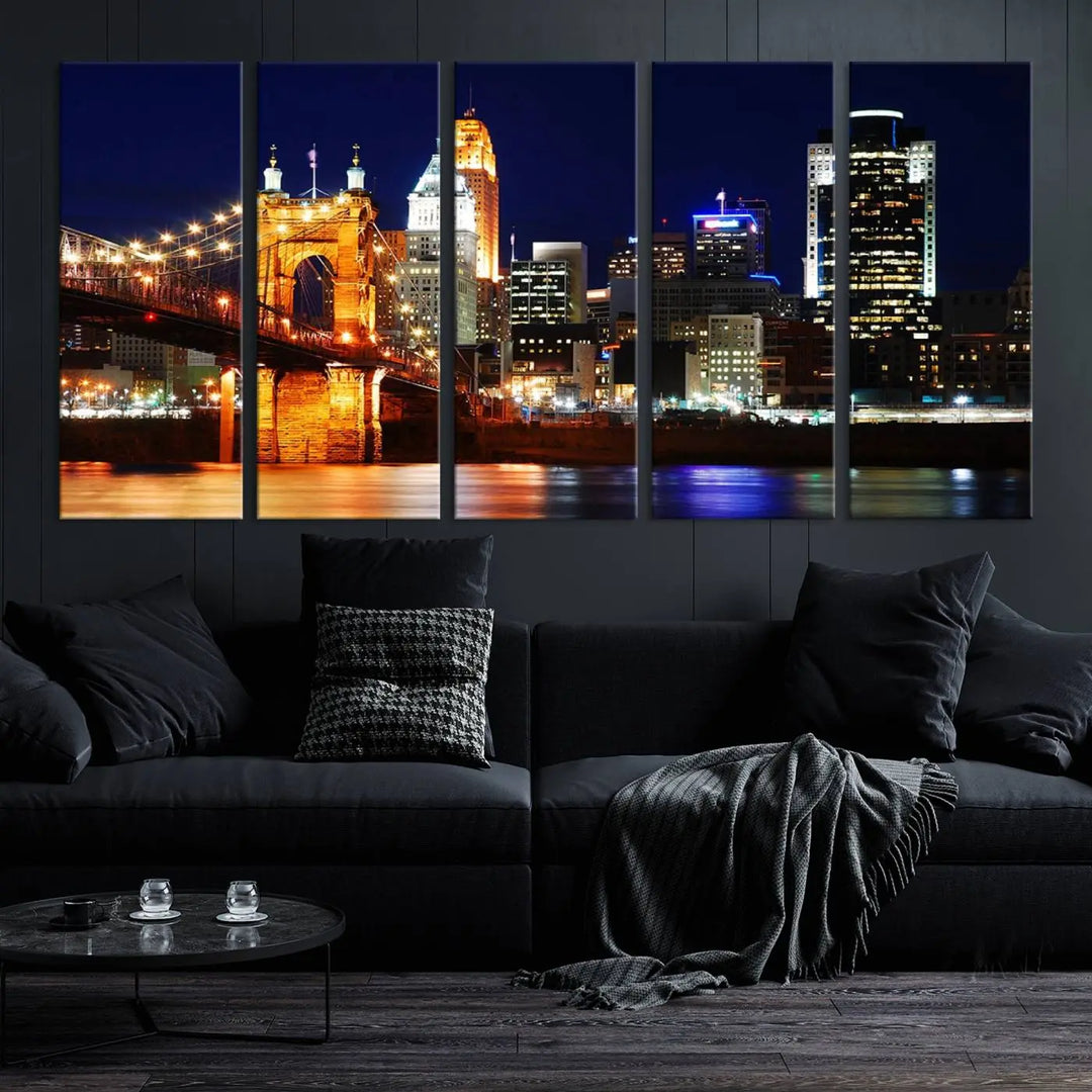 The Cincinnati City Lights Night Skyline Cityscape View Wall Art Canvas Print showcases a stunning night view of a city skyline with an illuminated bridge, making it an ideal museum-quality addition.