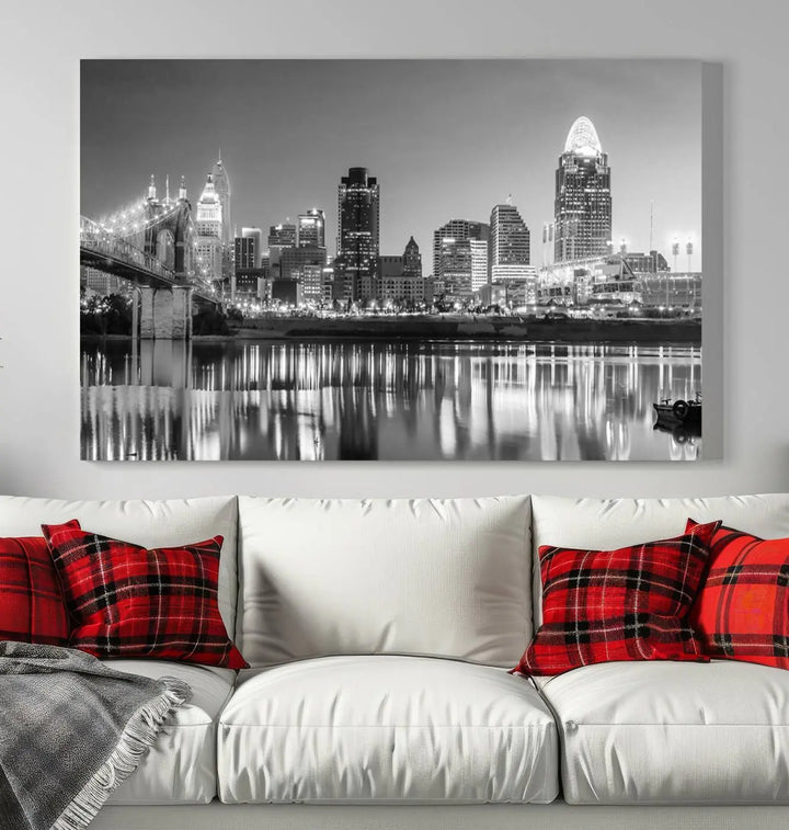 The "Cincinnati City Lights Skyline Black and White Wall Art Cityscape Canvas Print" is elegantly displayed in a stylish living room.