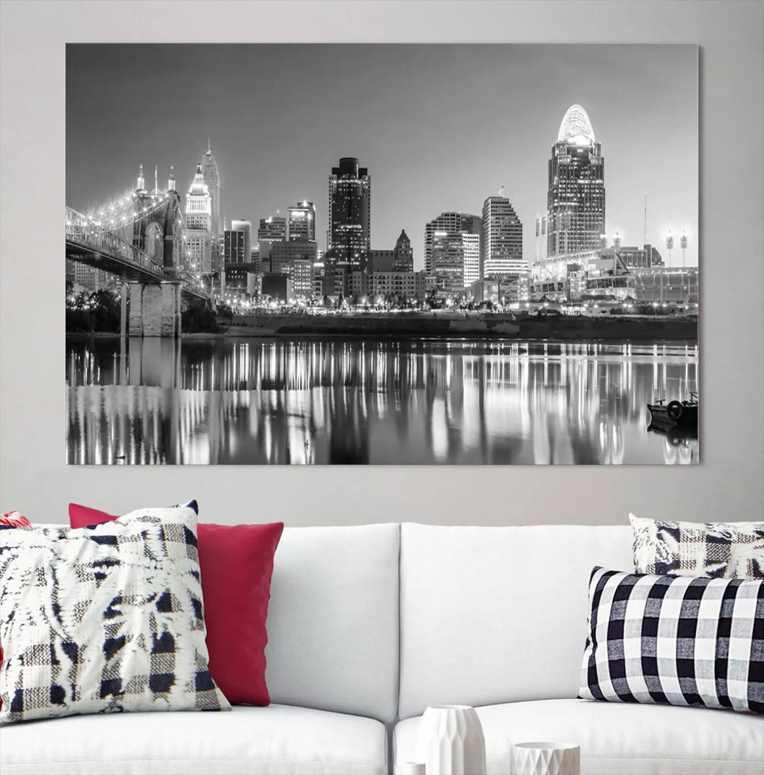 The "Cincinnati City Lights Skyline Black and White Wall Art Cityscape Canvas Print" is elegantly displayed in a stylish living room.