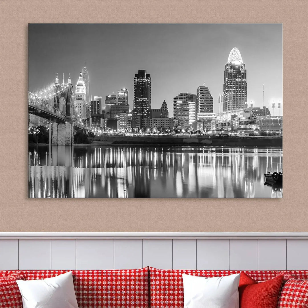 The "Cincinnati City Lights Skyline Black and White Wall Art Cityscape Canvas Print" is elegantly displayed in a stylish living room.