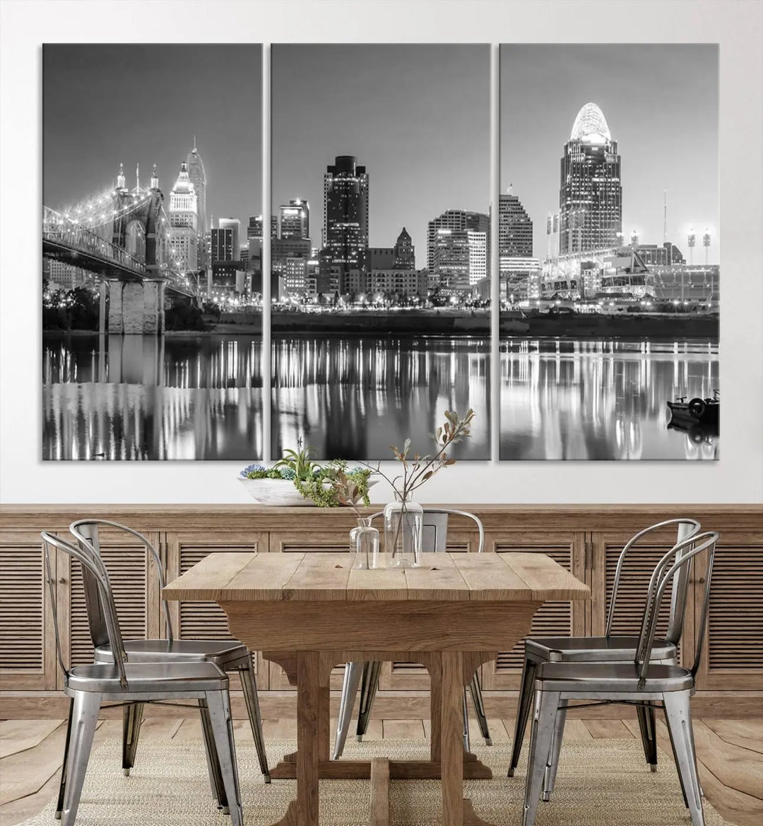 The "Cincinnati City Lights Skyline Black and White Wall Art Cityscape Canvas Print" is elegantly displayed in a stylish living room.