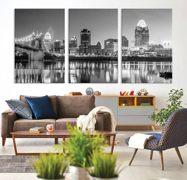 The "Cincinnati City Lights Skyline Black and White Wall Art Cityscape Canvas Print" is elegantly displayed in a stylish living room.