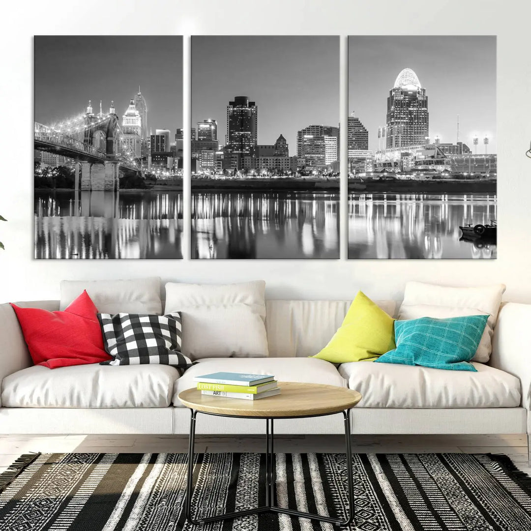 The "Cincinnati City Lights Skyline Black and White Wall Art Cityscape Canvas Print" is elegantly displayed in a stylish living room.