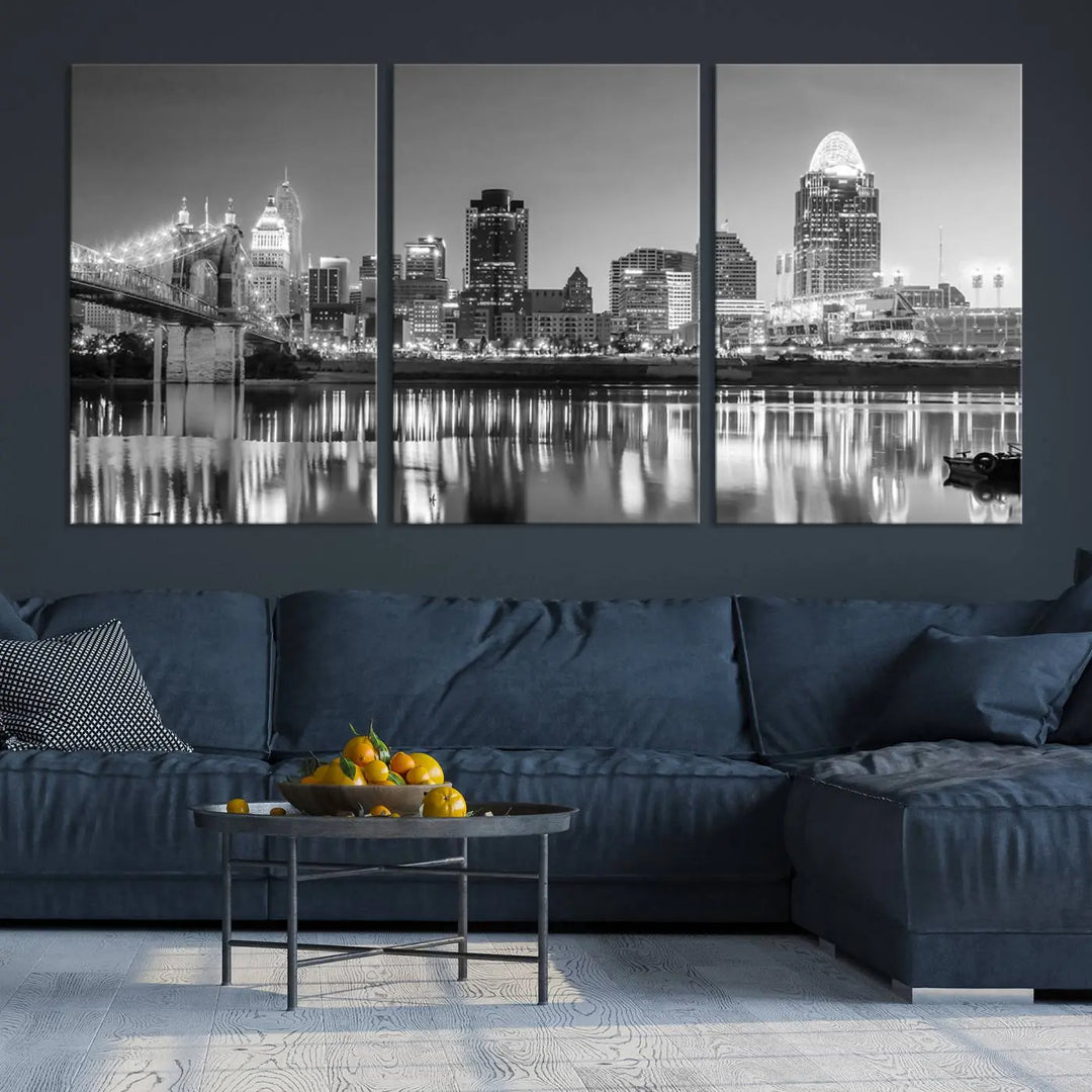 The "Cincinnati City Lights Skyline Black and White Wall Art Cityscape Canvas Print" is elegantly displayed in a stylish living room.