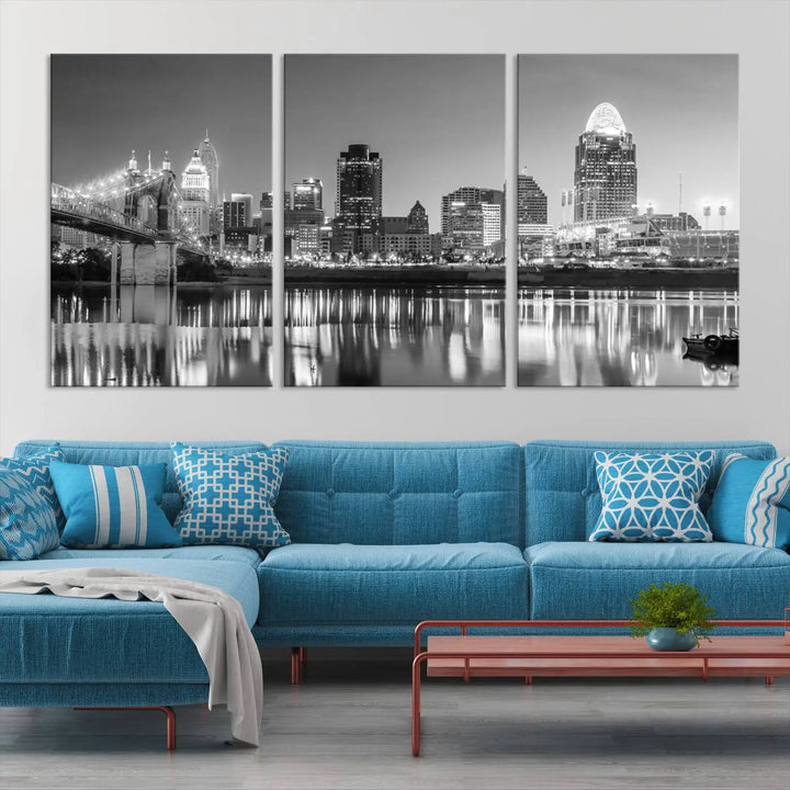 The "Cincinnati City Lights Skyline Black and White Wall Art Cityscape Canvas Print" is elegantly displayed in a stylish living room.