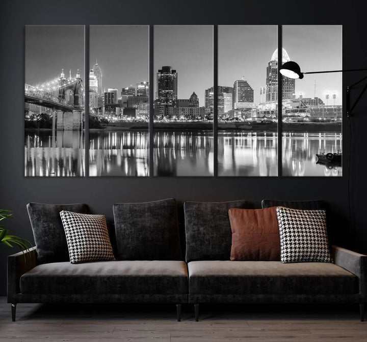 The "Cincinnati City Lights Skyline Black and White Wall Art Cityscape Canvas Print" is elegantly displayed in a stylish living room.