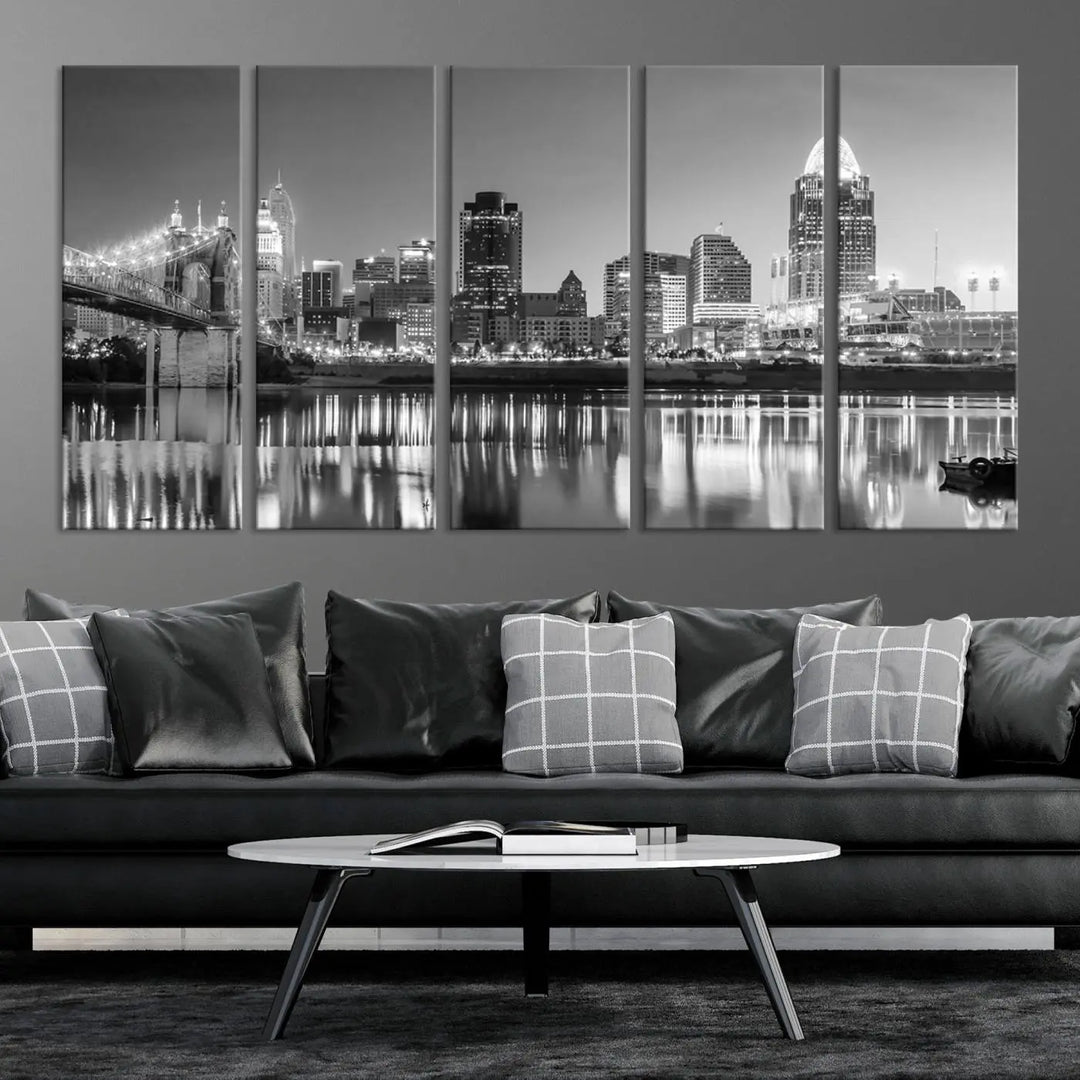 The "Cincinnati City Lights Skyline Black and White Wall Art Cityscape Canvas Print" is elegantly displayed in a stylish living room.