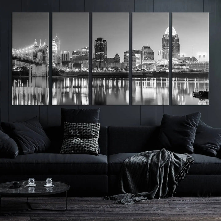 The "Cincinnati City Lights Skyline Black and White Wall Art Cityscape Canvas Print" is elegantly displayed in a stylish living room.