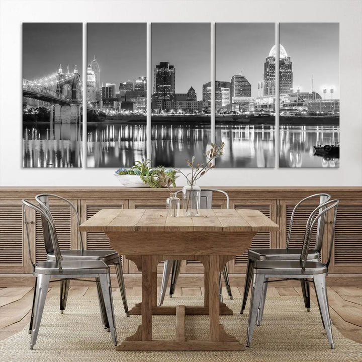 The "Cincinnati City Lights Skyline Black and White Wall Art Cityscape Canvas Print" is elegantly displayed in a stylish living room.