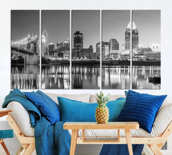 The "Cincinnati City Lights Skyline Black and White Wall Art Cityscape Canvas Print" is elegantly displayed in a stylish living room.