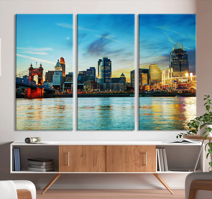 A triptych titled "Cincinnati City Lights Sunset Bright Blue Skyline Cityscape View Wall Art Canvas Print" is showcased, each canvas expertly crafted with museum-quality precision on a stretched wood frame.