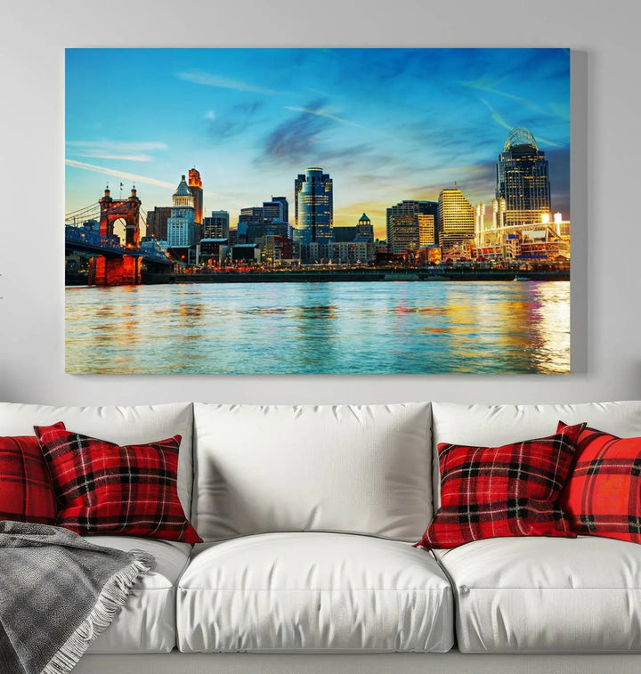 A triptych titled "Cincinnati City Lights Sunset Bright Blue Skyline Cityscape View Wall Art Canvas Print" is showcased, each canvas expertly crafted with museum-quality precision on a stretched wood frame.