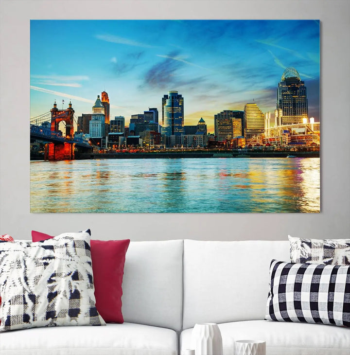 A triptych titled "Cincinnati City Lights Sunset Bright Blue Skyline Cityscape View Wall Art Canvas Print" is showcased, each canvas expertly crafted with museum-quality precision on a stretched wood frame.