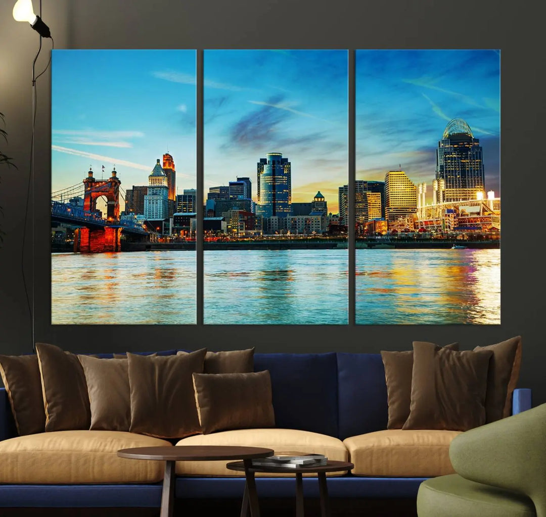 A triptych titled "Cincinnati City Lights Sunset Bright Blue Skyline Cityscape View Wall Art Canvas Print" is showcased, each canvas expertly crafted with museum-quality precision on a stretched wood frame.