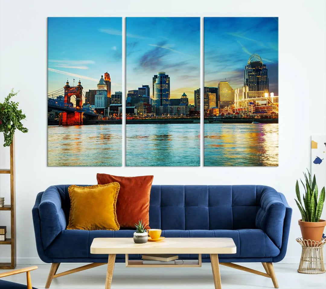 A triptych titled "Cincinnati City Lights Sunset Bright Blue Skyline Cityscape View Wall Art Canvas Print" is showcased, each canvas expertly crafted with museum-quality precision on a stretched wood frame.