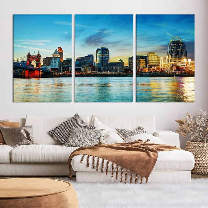 A triptych titled "Cincinnati City Lights Sunset Bright Blue Skyline Cityscape View Wall Art Canvas Print" is showcased, each canvas expertly crafted with museum-quality precision on a stretched wood frame.