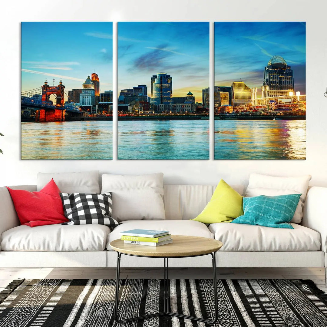 A triptych titled "Cincinnati City Lights Sunset Bright Blue Skyline Cityscape View Wall Art Canvas Print" is showcased, each canvas expertly crafted with museum-quality precision on a stretched wood frame.