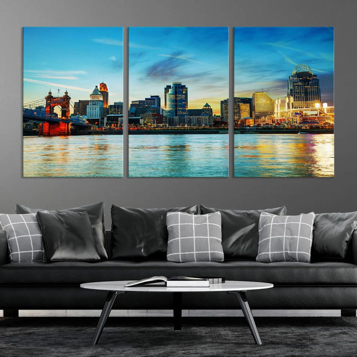 A triptych titled "Cincinnati City Lights Sunset Bright Blue Skyline Cityscape View Wall Art Canvas Print" is showcased, each canvas expertly crafted with museum-quality precision on a stretched wood frame.