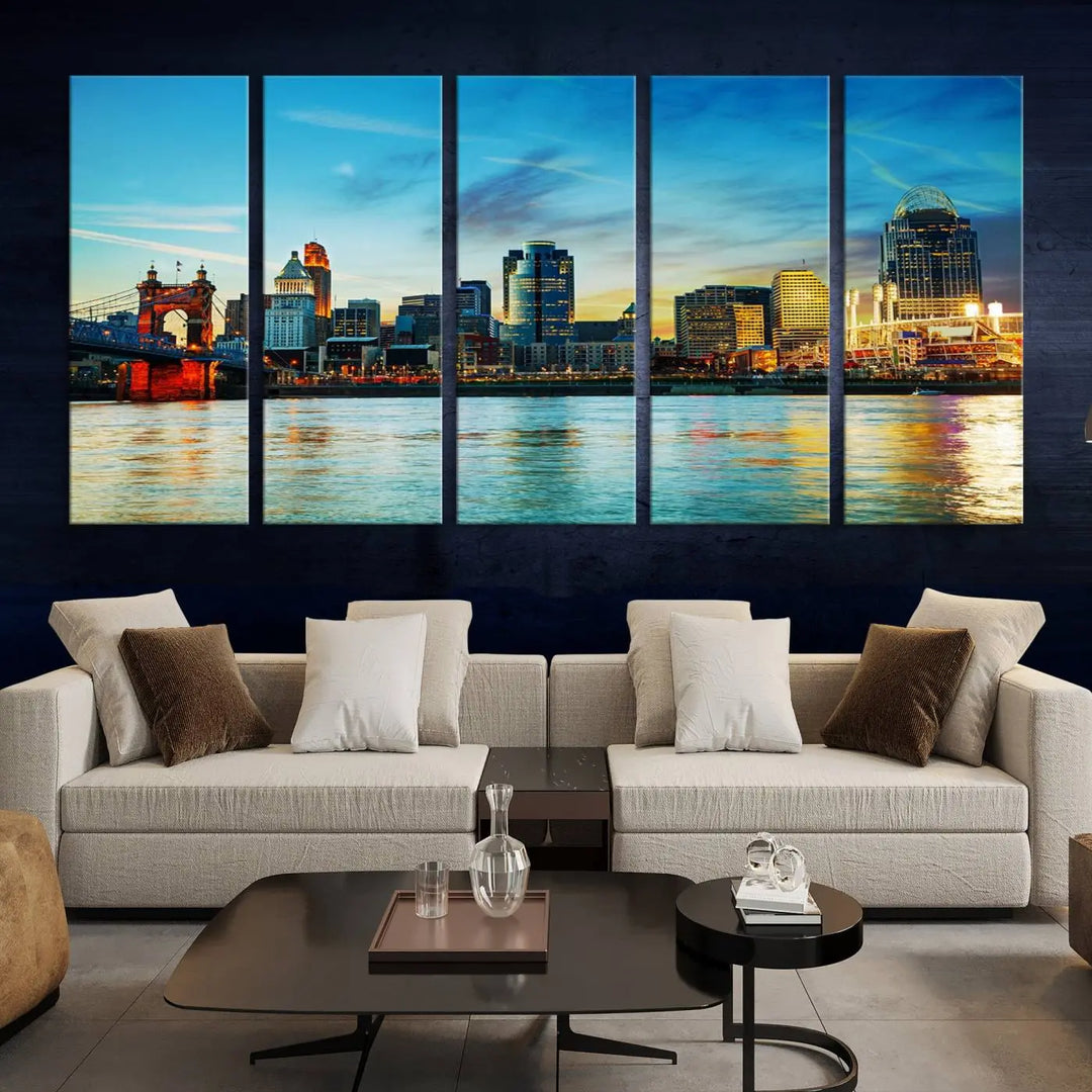 A triptych titled "Cincinnati City Lights Sunset Bright Blue Skyline Cityscape View Wall Art Canvas Print" is showcased, each canvas expertly crafted with museum-quality precision on a stretched wood frame.