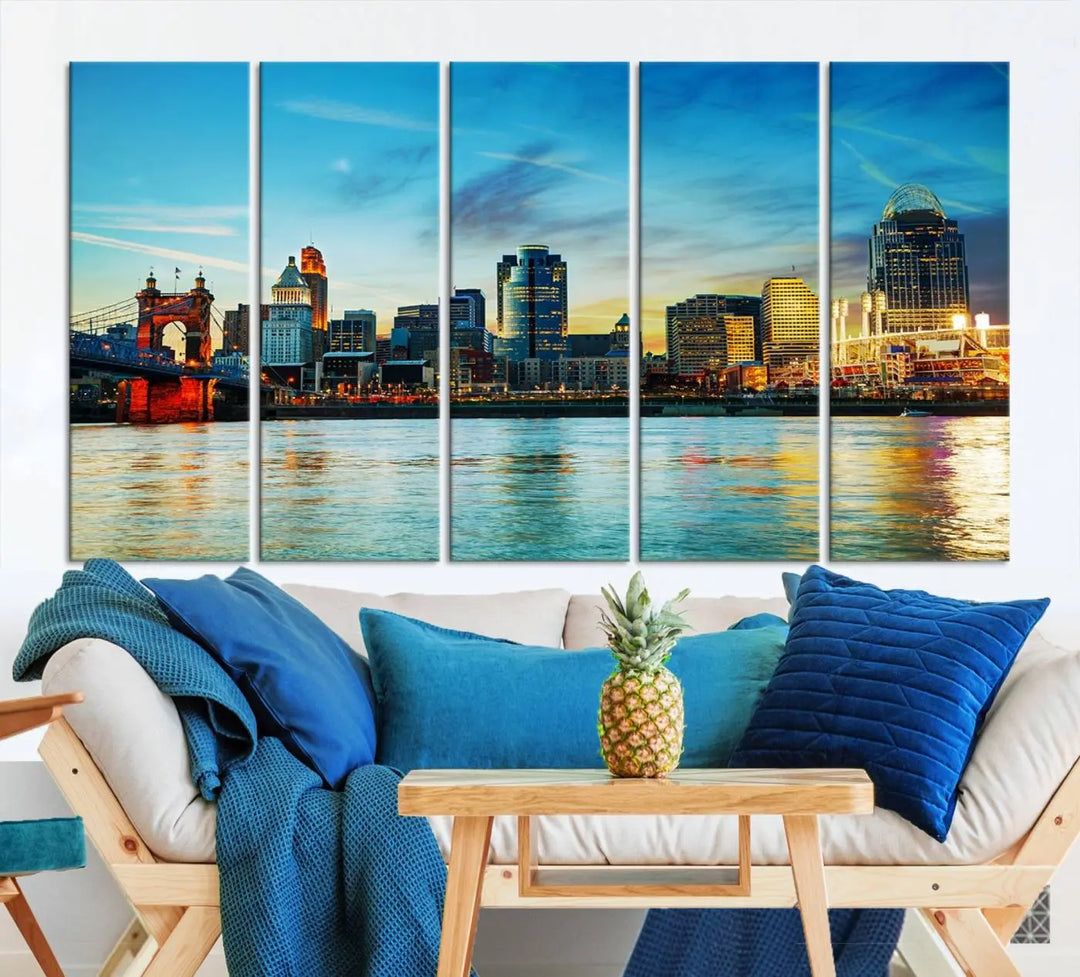 A triptych titled "Cincinnati City Lights Sunset Bright Blue Skyline Cityscape View Wall Art Canvas Print" is showcased, each canvas expertly crafted with museum-quality precision on a stretched wood frame.