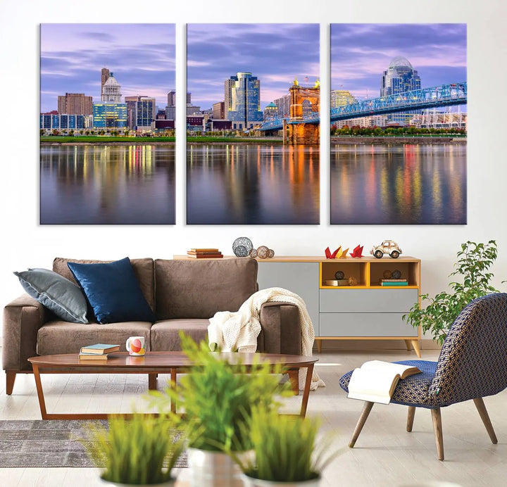 The room features the Cincinnati City Lights Sunset Purple Cloudy Skyline Cityscape View Wall Art Canvas Print, showcasing a breathtaking skyline reflecting on the river. Each piece is created with museum-quality canvas, includes UV-protective coating, and comes ready to hang.