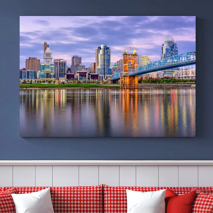 The room features the Cincinnati City Lights Sunset Purple Cloudy Skyline Cityscape View Wall Art Canvas Print, showcasing a breathtaking skyline reflecting on the river. Each piece is created with museum-quality canvas, includes UV-protective coating, and comes ready to hang.