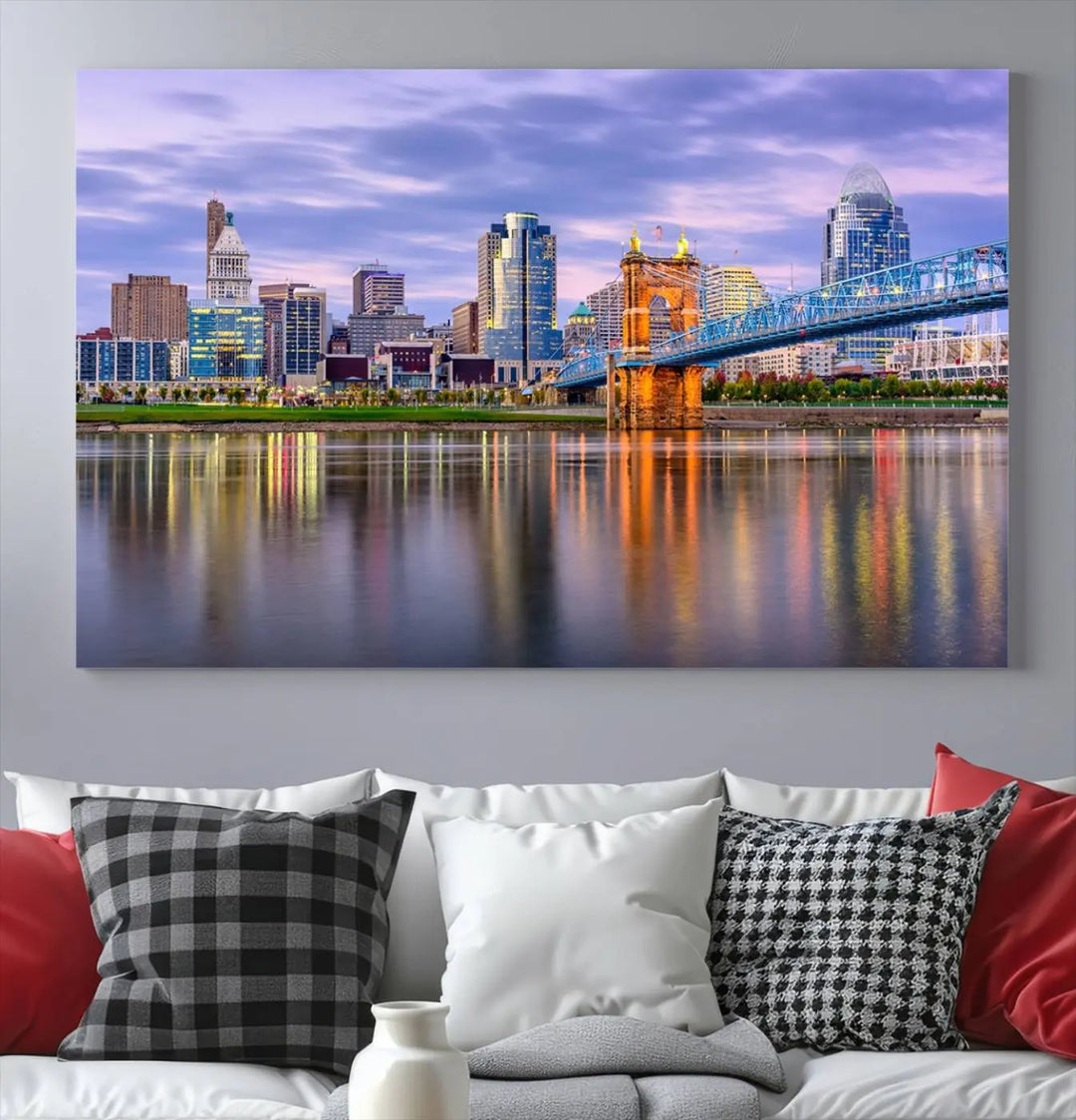 The room features the Cincinnati City Lights Sunset Purple Cloudy Skyline Cityscape View Wall Art Canvas Print, showcasing a breathtaking skyline reflecting on the river. Each piece is created with museum-quality canvas, includes UV-protective coating, and comes ready to hang.