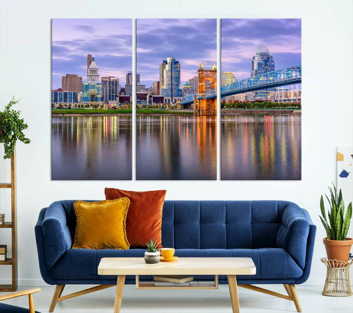 The room features the Cincinnati City Lights Sunset Purple Cloudy Skyline Cityscape View Wall Art Canvas Print, showcasing a breathtaking skyline reflecting on the river. Each piece is created with museum-quality canvas, includes UV-protective coating, and comes ready to hang.