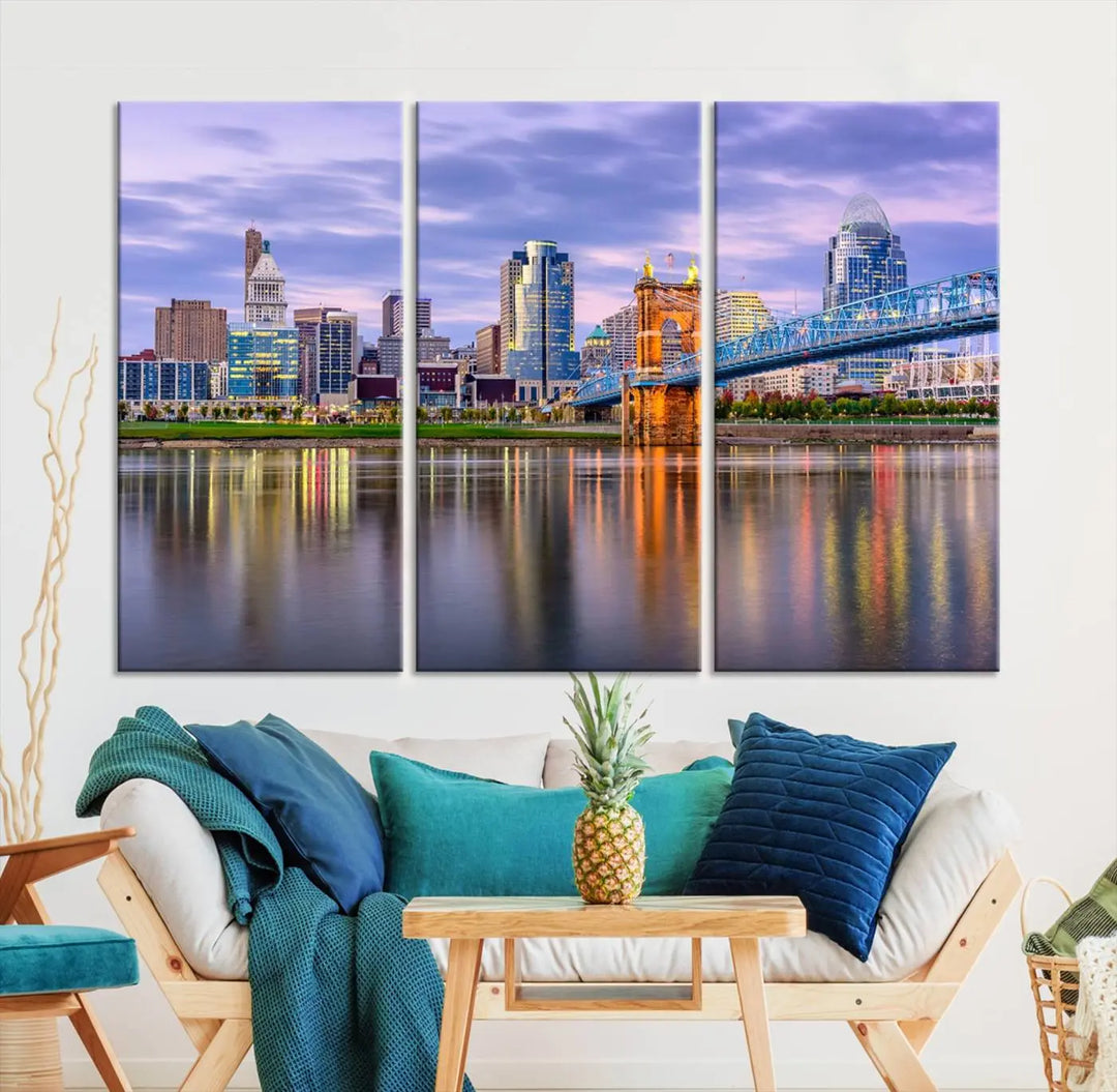 The room features the Cincinnati City Lights Sunset Purple Cloudy Skyline Cityscape View Wall Art Canvas Print, showcasing a breathtaking skyline reflecting on the river. Each piece is created with museum-quality canvas, includes UV-protective coating, and comes ready to hang.